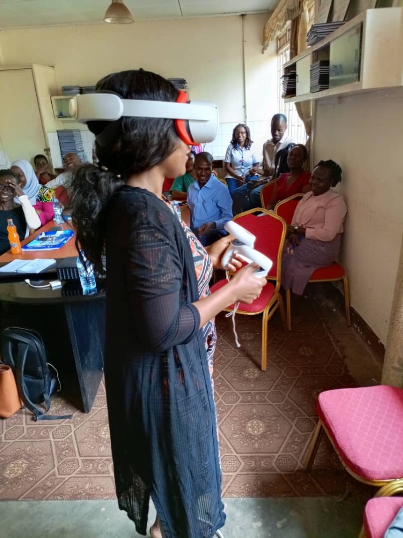 Clinical educator using a Goggleminds VR headset in Uganda